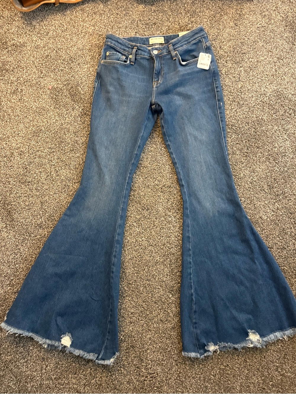 We The Free Blue High-Rise Flare Jeans with Raw Hem